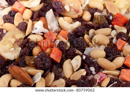 Macro photo of trail mix with peanuts, almonds, raisins, bananas and other natural foods