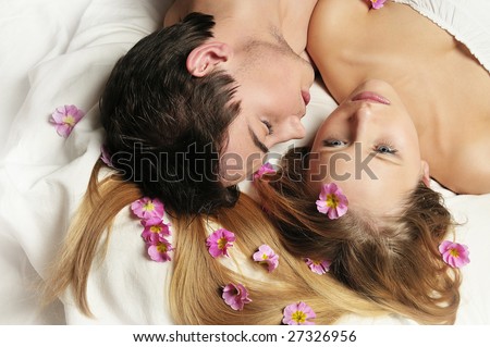 Boy and girl in love lying in the bed