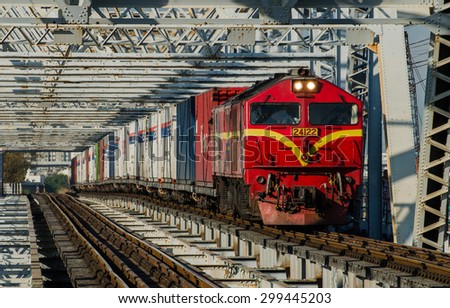 Padang Besar, Malaysia - 31 March 2014: Special trains International cargo Nippon Express BangSue, the locomotive of the train by Toshiba Class 24 No. 24122 - The container freight No.781