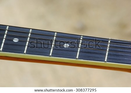 Guitar strings and fret board