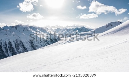 Similar – Foto Bild Gipfel hoher schneebedeckter Berge bei Sonnenuntergang