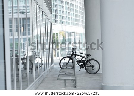 Similar – Foto Bild ein abgestelltes abgeschlossenes Fahrrad