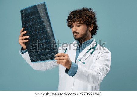 Similar – Image, Stock Photo Young doctor with x-ray film document on wall