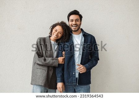 Similar – Image, Stock Photo Happy couple colleagues hugging on the street