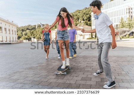 Similar – Foto Bild Kind mit Skateboard und Sonnenbrille macht Rocksymbol mit erhobenen Händen