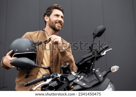 Similar – Image, Stock Photo Stylish man standing near wall