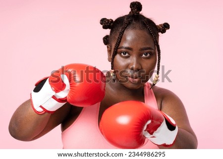Similar – Image, Stock Photo Serious sportswoman with boxer braids posing with crossed arms