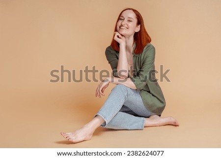 Image, Stock Photo Cheerful barefoot ginger woman waking up on bed