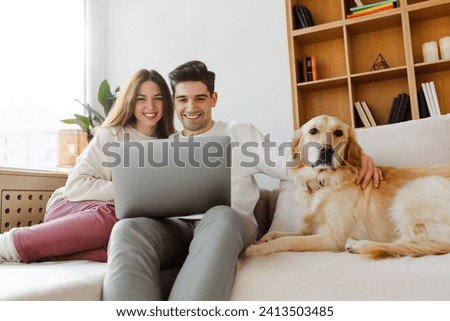 Similar – Image, Stock Photo Couple looking at laptop in kitchen.