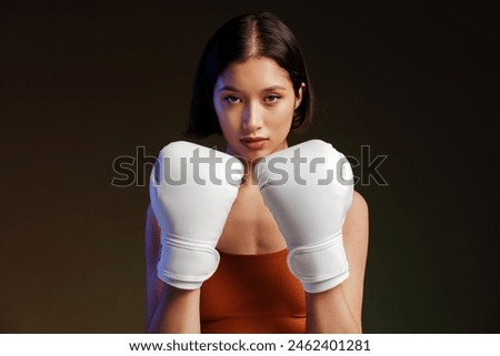 Similar – Image, Stock Photo Serious sportswoman with boxer braids posing with crossed arms