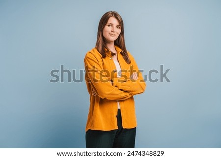 Similar – Image, Stock Photo Woman in stylish blue coat leaving office at sunset. Beautiful attractive young woman walking on the street at sunset or sunrise early in the morning near modern architecture buildings in the city. Casual candid lifestyle. Full body portrait.