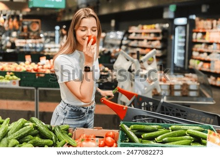 Similar – Image, Stock Photo A woman consumes a white line in powder form with a rolled banknote through her nose