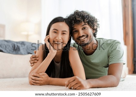 Similar – Image, Stock Photo Romantic loving diverse couple kissing in nature on sunny day