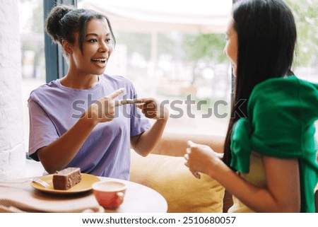 Similar – Image, Stock Photo Multiethnic friends talking in cafe