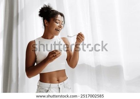 Similar – Image, Stock Photo African American woman eating strawberry