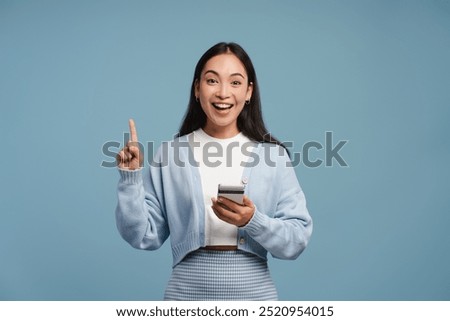 Similar – Image, Stock Photo Happy Asian woman browsing smartphone near car