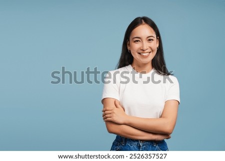 Similar – Image, Stock Photo Young beautiful smiling woman wearing silk scarf around her neck and leather jacket looking away standing at plain background