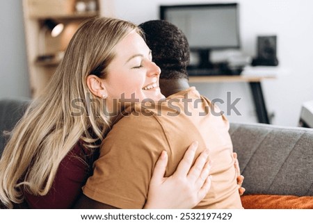 Similar – Image, Stock Photo Positive multiethnic couple embracing on street