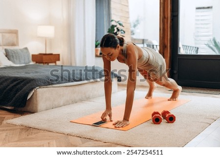 Similar – Image, Stock Photo Sportswoman doing exercise with dumbbells