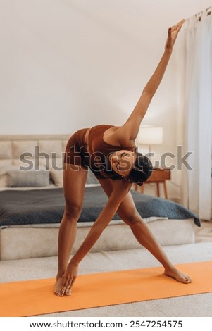 Similar – Image, Stock Photo Flexible young sportswoman practicing yoga on street