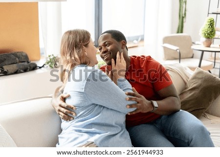 Similar – Image, Stock Photo Positive multiethnic couple kissing on street