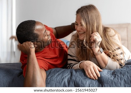 Similar – Image, Stock Photo Loving multiethnic couple resting together