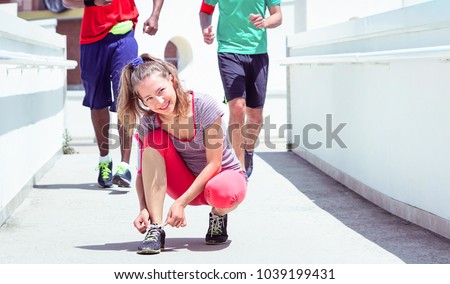 Image, Stock Photo A teenage girl ties her shoelaces in sneakers, prepares for training