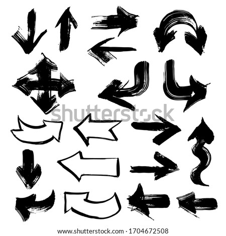 Arrows in different directions painted with thick paint strokes isolated on a white background
