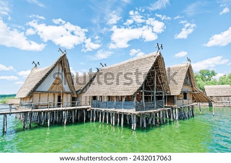 Similar – Foto Bild Haus auf Stelzen am See in der Nähe der Berge