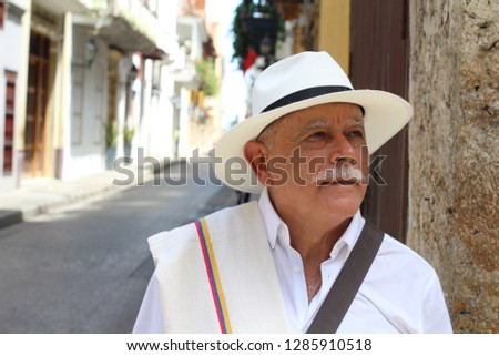 Similar – Image, Stock Photo A man in a hat looks friendly and a little bit melancholic into the camera