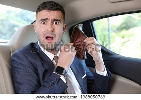Surprised businessman with empty wallet after paying taxi Stock foto © 