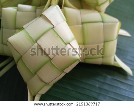 Ketupat in Indonesia is a kind of way of cooking rice by inserting rice into a coconut leaf which is shaped like a diamond. Then steamed. Very famous in Indonesia. Usually appears on Eid al-Fitr. Clos Stok fotoğraf © 