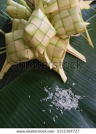 Ketupat in Indonesia is a kind of way of cooking rice by inserting rice into a coconut leaf which is shaped like a diamond. Then steamed. Very famous in Indonesia. Usually appears on Eid al-Fitr. Clos Stok fotoğraf © 