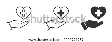 Hand holds heart with cross inside. Heart with a cross icon. Vector illustration.