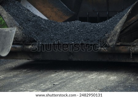 Similar – Foto Bild Arbeiter mit Asphaltfertigerwerkzeug beim Straßenbau.