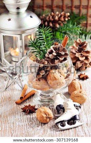 Walnuts, pine cone, and cinnamon, Christmas decoration, holiday season, selective focus