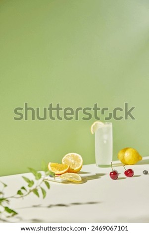 Similar – Image, Stock Photo Cool lemonade with juicy nectarine in glass and yellow drinking straw on a white tray full of ice cubes