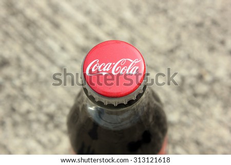 SEREMBAN, MALAYSIA - MAY 22, 2015: bottle caps can of Coca-Cola Classic