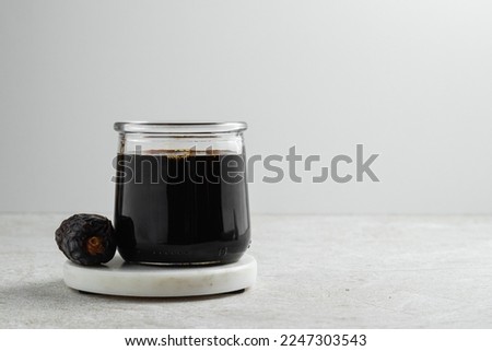 Similar – Image, Stock Photo Brown glass jar near fir branches and pine cones on dark green top view. Brand packaging mockup.