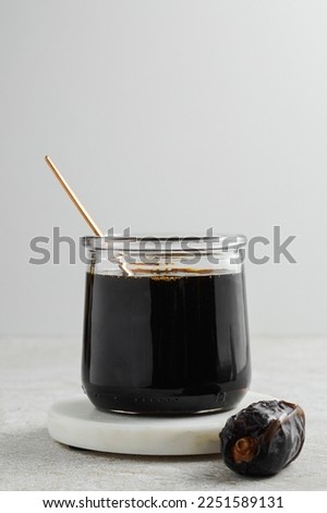 Similar – Image, Stock Photo Brown glass jar near fir branches and pine cones on dark green top view. Brand packaging mockup.