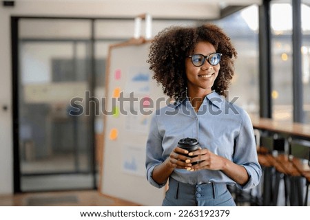 Similar – Image, Stock Photo Woman holding a cup of hot chocolate with marshmallows.