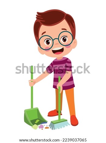 cute little boy cleaning with broom and shovel