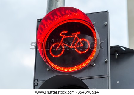 Similar – Foto Bild Radweg mit roter Fahrbahnmarkierung bei winterlichen Straßenverhältnissen.