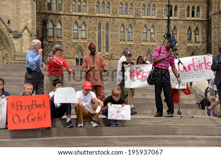 OTTAWA - MAY 22:  People gather for a rally to activate governments to rescue the girls in Nigeria and protect school girls across the world on Parliament Hill during May 22, 2014 in Ottawa, Canada