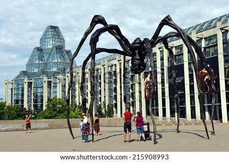 OTTAWA - JULY 2, 2011:  The National Gallery of Canada, a popular tourist attraction designed by Moshe Safdie that opened in 1988. The spider sculpture is the famous Maman by Louise Bourgeois.