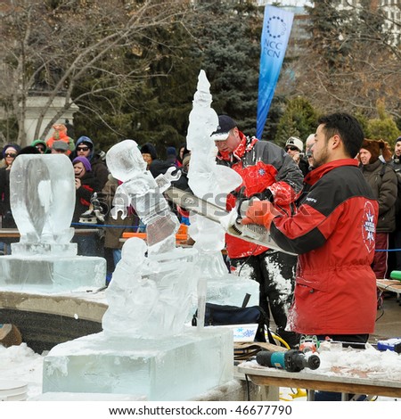 OTTAWA, CANADA – FEB 14: Ice sculptors at work during the Winterlude Festival on February 14, 2010 in Ottawa, Canada.