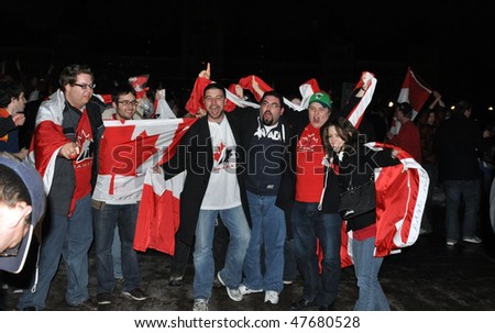 OTTAWA, CANADA - FEBRUARY 28:  Canadian fans celebrate the Canadian men\'s ice hockey gold medal win in the Winter Olympics.  February 28, 2010, Ottawa, Ontario