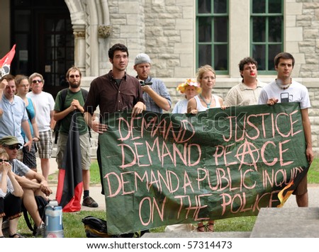 OTTAWA, CANADA - JULY 17: People gather to demand a public inquiry into police conduct at the recent G20 conference in Toronto.  July 17, 2010, in Ottawa, Ontario.