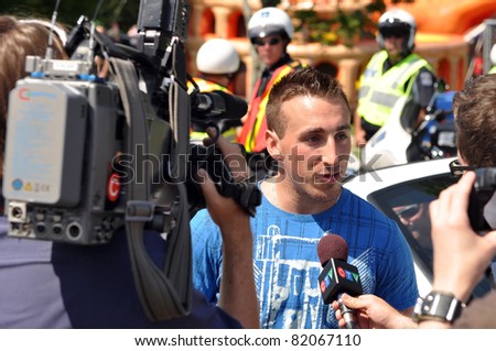 DARTMOUTH, CANADA - AUG 1:  Halifax native Brad Marchand of the Stanley Cup champion Boston Bruins is interviewed after the 116th Natal Day Parade Aug 1,2011 in Halifax/Dartmouth Nova Scotia.