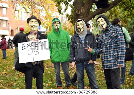 TORONTO, CANADA – OCT 15:  Unidentified demonstrators in Guy Fawkes masks gathered at Saint James Park in downtown Toronto, for the Toronto version of Occupy Wall Street, Oct. 15 2011.